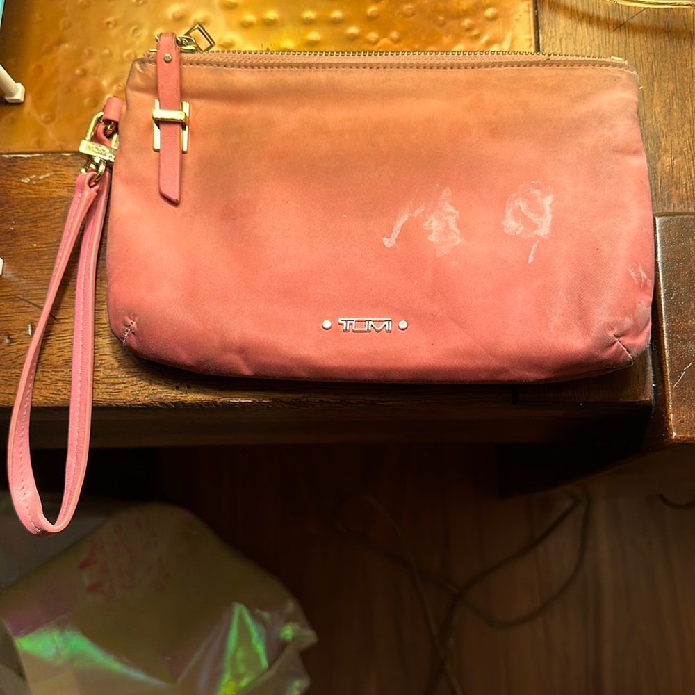 Pink TUMI wristlet pouch
